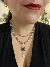 Load image into Gallery viewer, This Dainty Smiling Crescent Moon And Star Silver And Gray Choker Style Necklace features a variety of shimmering glass beads in light silver and gray tones. Varying in shape and size, these beads lend a unique and witchy celestial vibe to the necklace.  Measurements:  Necklace is 15 3/4”adjustable up to 18&quot;
