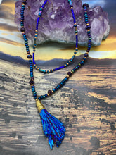 Load image into Gallery viewer, This structured royal blue kyanite stone pendant is 1 3/4” in length. The two accompanying strands of glass beads and rectangular hematite beads work together to bring out the vibrant colors of this celestial gemstone. In this combination, purples, blues, greens, and golds are juxtaposed for an eye-catching display.  Necklace is 15” in length, can be adjusted to 18&quot; in length 
