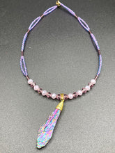 Load image into Gallery viewer, This Rainbow Kyanite Wired Stone Pendant features two strands of glass bead necklaces with a dazzling spectrum of colors, including purple, pink, gold, blue, and green. This bold piece of jewelry is guaranteed to add an eye-catching touch to any collection.  Measurements:  Necklace is 17” in length, can be adjusted to 18&quot;
