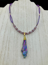 Load image into Gallery viewer, This Rainbow Kyanite Wired Stone Pendant features two strands of glass bead necklaces with a dazzling spectrum of colors, including purple, pink, gold, blue, and green. This bold piece of jewelry is guaranteed to add an eye-catching touch to any collection.  Measurements:  Necklace is 17” in length, can be adjusted to 18&quot;

