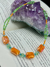 Load image into Gallery viewer, This unique, double-strand necklace consists of a blend of glass beads, including multi-green and rectangular, faceted orange glass beads, and is accented with gold and light blue elements. The vibrant combination is perfect for any summer look and will enhance any outfit.  Measurements:  Necklace is 16” and can be adjusted up to 18&quot;
