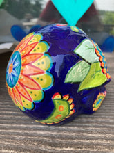 Load image into Gallery viewer, I wanted to create a skully that represented the eternal love for a special kitty cat in your life. Dark royal blue ceramic sugar skull with black cat silhouette is sitting admiring the sun going down. This Day Of The Dead ceramic skull art was created for the cat lovers who adore their sweet kitty. Measurements: H 4” x W 4” x D 5 1/2”

