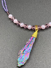 Load image into Gallery viewer, This Rainbow Kyanite Wired Stone Pendant features two strands of glass bead necklaces with a dazzling spectrum of colors, including purple, pink, gold, blue, and green. This bold piece of jewelry is guaranteed to add an eye-catching touch to any collection.  Measurements:  Necklace is 17” in length, can be adjusted to 18&quot;

