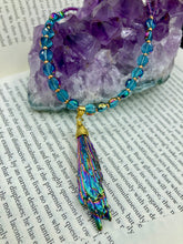 Load image into Gallery viewer, This necklace boasts a stunning Rainbow Kyanite wired stone pendant and two strands of shimmering glass beads. The blues contain hues of pink, gold, blue and green, offering a vibrant and bold addition to any jewelry collection.  Measurements:  Necklace is 17” in length, can be adjusted to 18&quot;
