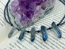 Load image into Gallery viewer, This sophisticated double-strand necklace glitters with silver and gray-tone glass beads, complemented by luminous blue crystal stone nuggets. It gracefully drapes around the neck. Measurements:  Necklace is 15 1/4”adjustable up to 17&quot; in length
