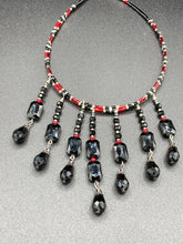 Load image into Gallery viewer, This Vampire Goth style choker necklace features a mix of black and red glass beads with a hanging large tear drop black bead that gives it a depth and complexity of color. Perfect for formal dresses as it gracefully drapes down the neck. Necklace is 15” adjustable to 18"
