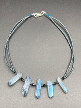 Load image into Gallery viewer, This sophisticated double-strand necklace glitters with silver and gray-tone glass beads, complemented by luminous blue crystal stone nuggets. It gracefully drapes around the neck. Measurements:  Necklace is 15 1/4”adjustable up to 17&quot; in length
