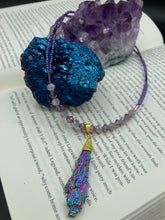 Load image into Gallery viewer, This Rainbow Kyanite Wired Stone Pendant features two strands of glass bead necklaces with a dazzling spectrum of colors, including purple, pink, gold, blue, and green. This bold piece of jewelry is guaranteed to add an eye-catching touch to any collection.  Measurements:  Necklace is 17” in length, can be adjusted to 18&quot;
