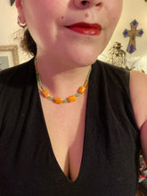 Load image into Gallery viewer, This unique, double-strand necklace consists of a blend of glass beads, including multi-green and rectangular, faceted orange glass beads, and is accented with gold and light blue elements. The vibrant combination is perfect for any summer look and will enhance any outfit.  Measurements:  Necklace is 16” and can be adjusted up to 18&quot;
