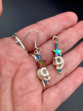 Load image into Gallery viewer, Mini Howlite Skull Bead Earrings, star shaped rainbow hematite beads for a fun pastel goth vibe. Perfect for pastel goth, dark witchy, celestial galaxy stardust, day of the dead jewelry. You can dress these up or down, it will definitely give your outfit a unique look.  Measurements: 1 1/2 ” in length
