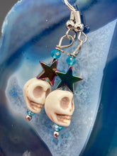 Load image into Gallery viewer, Mini Howlite Skull Bead Earrings, star shaped rainbow hematite beads for a fun pastel goth vibe. Perfect for pastel goth, dark witchy, celestial galaxy stardust, day of the dead jewelry. You can dress these up or down, it will definitely give your outfit a unique look.  Measurements: 1 1/2 ” in length
