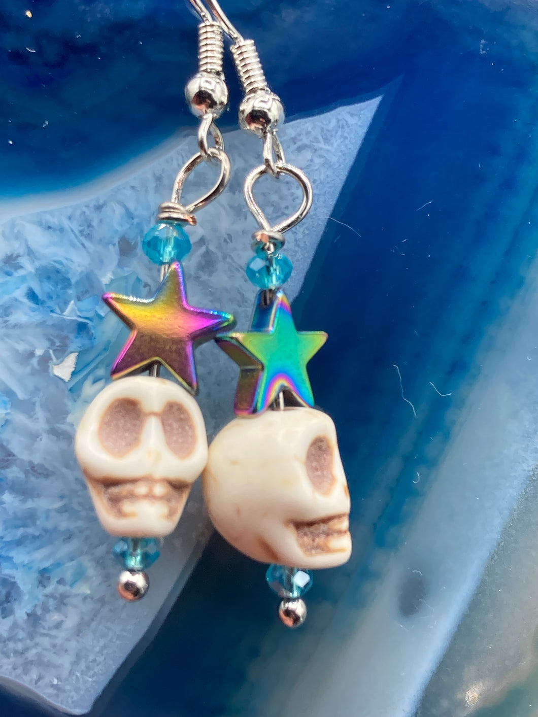 Mini Howlite Skull Bead Earrings, star shaped rainbow hematite beads for a fun pastel goth vibe. Perfect for pastel goth, dark witchy, celestial galaxy stardust, day of the dead jewelry. You can dress these up or down, it will definitely give your outfit a unique look.  Measurements: 1 1/2 ” in length