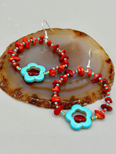 Load image into Gallery viewer, These Bamboo coral red stone chip earrings feature a subtle hoop design adorned with tiny turquoise, red, and gold glass beads. Completing the look is a turquoise flower pendant with a dark red glass bead in the center. Measurements: 2&quot; length 
