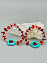 Load image into Gallery viewer, These Bamboo coral red stone chip earrings feature a subtle hoop design adorned with tiny turquoise, red, and gold glass beads. Completing the look is a turquoise flower pendant with a dark red glass bead in the center. Measurements: 2&quot; length 
