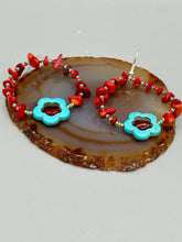 Load image into Gallery viewer, These Bamboo coral red stone chip earrings feature a subtle hoop design adorned with tiny turquoise, red, and gold glass beads. Completing the look is a turquoise flower pendant with a dark red glass bead in the center. Measurements: 2&quot; length 
