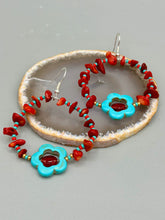 Load image into Gallery viewer, These Bamboo coral red stone chip earrings feature a subtle hoop design adorned with tiny turquoise, red, and gold glass beads. Completing the look is a turquoise flower pendant with a dark red glass bead in the center. Measurements: 2&quot; length 
