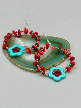 Load image into Gallery viewer, These Bamboo coral red stone chip earrings feature a subtle hoop design adorned with tiny turquoise, red, and gold glass beads. Completing the look is a turquoise flower pendant with a dark red glass bead in the center. Measurements: 2&quot; length 
