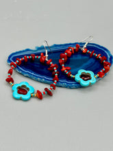 Load image into Gallery viewer, These Bamboo coral red stone chip earrings feature a subtle hoop design adorned with tiny turquoise, red, and gold glass beads. Completing the look is a turquoise flower pendant with a dark red glass bead in the center. Measurements: 2&quot; length 
