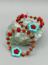 Load image into Gallery viewer, These bamboo coral red stone chip earrings feature tiny turquoise, green, and gold glass beading. Accenting the vibrant design is a turquoise flower pendant with quartzite rose beads for added detail. Measurements: 2 1/4&quot; length 
