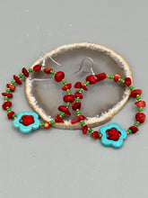 Load image into Gallery viewer, These bamboo coral red stone chip earrings feature tiny turquoise, green, and gold glass beading. Accenting the vibrant design is a turquoise flower pendant with quartzite rose beads for added detail.  Measurements: 2 1/4" length 
