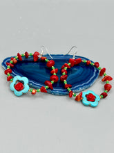 Load image into Gallery viewer, These bamboo coral red stone chip earrings feature tiny turquoise, green, and gold glass beading. Accenting the vibrant design is a turquoise flower pendant with quartzite rose beads for added detail. Measurements: 2 1/4&quot; length 
