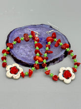 Load image into Gallery viewer, These bamboo coral red stone chip beaded hoop earrings feature green and gold glass, while a white magnesite flower pendant and quartzite rose beads add detail. Measurements: 3" length  
