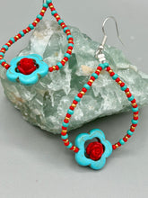 Load image into Gallery viewer, These gorgeous turquoise magnesite floral beaded earrings exude a hippie-style and shabby-chic vibe. The beautiful turquoise magnesite beads are decorated with quartzite rose beads and red, turquoise, and gold glass beads, giving a unique and nature-inspired look that is perfect for Bohemian fashion. Measurements: 2 1/2" length 
