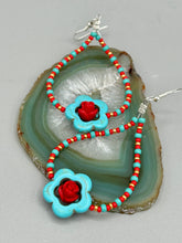 Load image into Gallery viewer, These gorgeous turquoise magnesite floral beaded earrings exude a hippie-style and shabby-chic vibe. The beautiful turquoise magnesite beads are decorated with quartzite rose beads and red, turquoise, and gold glass beads, giving a unique and nature-inspired look that is perfect for Bohemian fashion. Measurements: 2 1/2" length 
