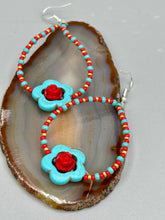 Load image into Gallery viewer, These gorgeous turquoise magnesite floral beaded earrings exude a hippie-style and shabby-chic vibe. The beautiful turquoise magnesite beads are decorated with quartzite rose beads and red, turquoise, and gold glass beads, giving a unique and nature-inspired look that is perfect for Bohemian fashion. Measurements: 2 1/2" length 
