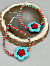 Load image into Gallery viewer, These gorgeous turquoise magnesite floral beaded earrings exude a hippie-style and shabby-chic vibe. The beautiful turquoise magnesite beads are decorated with quartzite rose beads and red, turquoise, and gold glass beads, giving a unique and nature-inspired look that is perfect for Bohemian fashion. Measurements: 2 1/2" length 
