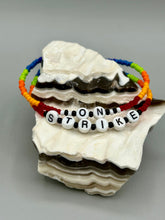 Load image into Gallery viewer, Rainbow Pride beaded bracelet ON STRIKE Metal wire with hook-eye clasp.
