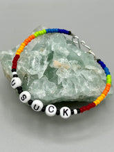 Load image into Gallery viewer, This set of Sarcastic Beaded Bracelets features fun and fashionable accessories perfect for any occasion. Crafted from metal wire and equipped with a hook-eye clasp, these sassy, sarcastic bracelets come in black and white and rainbow style. They are sure to make a statement. A fun addition to any accessory collection.   Measurements:  Black and White Color &quot;Dead Inside&quot;: 8 1/4&quot; in length  Rainbow Color &quot;U Suck&quot;: 8 1/2” in length 
