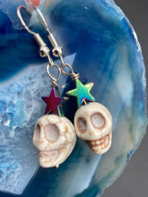 Load image into Gallery viewer, Howlite Skull Beads Earrings With Large Star Shapes Rainbow Hematite Bead. Versatile style, pastel goth, celestial stardust, witchy, day of the dead. You can dress these up or down, it will definitely give your outfit a unique look.   Measurements: 1 ” in length
