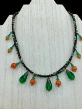 Load image into Gallery viewer, This necklace is the perfect addition to any collection, boasting a dark, elegant aesthetic inspired by nature. Comprised of two strands of glass beads with a variety of shapes and colors, it offers subtle autumnal vibrancy with its orange and green pumpkin-shaped glass beads. This piece is full of shimmer and complexity, providing unique depth and flair. Necklace is 16 1/2” in length, can be adjusted up to 18 1/2&quot;
