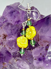 Load image into Gallery viewer, This delicate jewelry displays an array of gentle hues, vibrant yet soft.This light yellow pressed glass floral beaded bracelet and earrings set features an iridescent shimmer finish and is crafted with metal wire and a lobster claw clasp for easy closure. Measurements:  Bracelet: 8 1/2&quot; in length   Earrings: 1 1/4&quot; length
