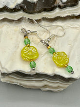 Load image into Gallery viewer, This delicate jewelry displays an array of gentle hues, vibrant yet soft.This light yellow pressed glass floral beaded bracelet and earrings set features an iridescent shimmer finish and is crafted with metal wire and a lobster claw clasp for easy closure. Measurements:  Bracelet: 8 1/2&quot; in length   Earrings: 1 1/4&quot; length
