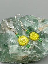 Load image into Gallery viewer, This delicate jewelry displays an array of gentle hues, vibrant yet soft.This light yellow pressed glass floral beaded bracelet and earrings set features an iridescent shimmer finish and is crafted with metal wire and a lobster claw clasp for easy closure. Measurements:  Bracelet: 8 1/2&quot; in length   Earrings: 1 1/4&quot; length
