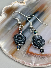 Load image into Gallery viewer, These gorgeous Black Metallic Floral Glass Beaded Earrings are the perfect accessory for any outfit. Shabby Boho Chic and nature-inspired, these earrings give you the style versatility you need. Dress these up or down depending on the occasion - you can&#39;t go wrong.  Measurements: 1 1/4 ” in length
