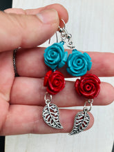 Load image into Gallery viewer, This alluring set of earrings captures the vibrant, enchanting beauty of the desert, featuring blue turquoise and bright red accents, highly detailed quartize rose beads and intricate silver plated leaf, providing fun movement. Perfect for those who love the Southwestern feel, Dia De Los Muertos, they can be dressed up or down, giving your fashion a unique touch.  Measurements: 2” in length
