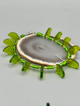 Load image into Gallery viewer, This nature-inspired jewelry is crafted from shimmering glass beads in shades of light and dark green as well as clear iridescent and gold tones. Light and dark green glass leaf beaded anklet and earrings provide intricate detailing. Crafted with metal wire and a barrel screw clasp, they offer a secure fit.
