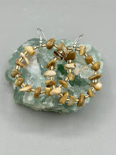 Load image into Gallery viewer, These lightweight Natural Bamboo Chip Beaded Hoop Earrings are perfect for any boho chic look. The combination of neutral colors and nature inspired design makes them the perfect accessory for any outfit. The glass beads add a subtle sparkle to complete the hippie vibe.  Measurements: 1 1/2&quot; length
