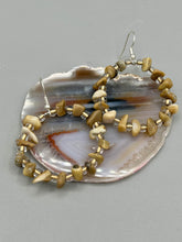 Load image into Gallery viewer, These lightweight Natural Bamboo Chip Beaded Hoop Earrings are perfect for any boho chic look. The combination of neutral colors and nature inspired design makes them the perfect accessory for any outfit. The glass beads add a subtle sparkle to complete the hippie vibe.  Measurements: 1 1/2&quot; length
