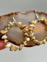 Load image into Gallery viewer, These lightweight Natural Bamboo Chip Beaded Hoop Earrings are perfect for any boho chic look. The combination of neutral colors and nature inspired design makes them the perfect accessory for any outfit. The glass beads add a subtle sparkle to complete the hippie vibe.  Measurements: 1 1/2&quot; length
