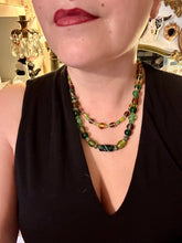 Load image into Gallery viewer, Two strands of beads compose this necklace, featuring a striking combination of light and dark greens, amber, golds, and dark browns. A mixture of glass and metal beads with patina color adds texture and beauty to this unique, bold statement piece.  Measurements:  Necklace is 17 1/2” in length, can be adjusted up to 19&quot; 
