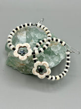 Load image into Gallery viewer, These handcrafted bohemian earrings combine an eye-catching white magnesite flower bead with a tiny hematite star bead, all charmingly displayed in a bone and glass beaded hoop. Perfect for adding a touch of hippie, shabby chic or boho chic vibes to your style. Measurements: 2" length  
