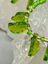 Load image into Gallery viewer, Light green glass leaf beaded earrings are intricately designed, making them ideal for styling in all seasons. Measurements:  Earrings: 2 1/4&quot; length
