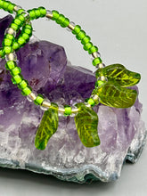 Load image into Gallery viewer, Light green glass leaf beaded earrings are intricately designed, making them ideal for styling in all seasons. Measurements:  Earrings: 2 1/4&quot; length
