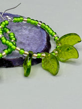 Load image into Gallery viewer, Light green glass leaf beaded earrings are intricately designed, making them ideal for styling in all seasons. Measurements:  Earrings: 2 1/4&quot; length

