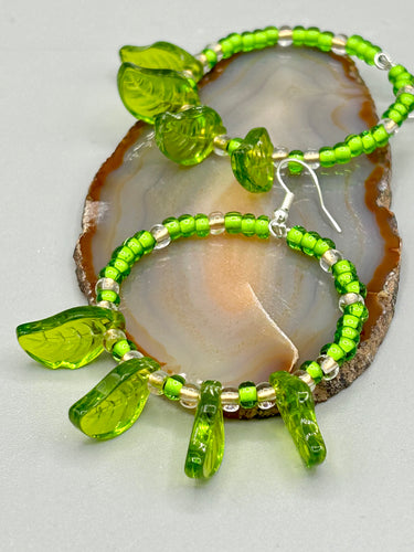 Light green glass leaf beaded earrings are intricately designed, making them ideal for styling in all seasons. Measurements:  Earrings: 2 1/4