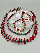 Load image into Gallery viewer, These bamboo coral red stone chip beaded hoop earrings feature green and gold glass, while a white magnesite flower pendant and quartzite rose beads add detail. Measurements: 3" length  
